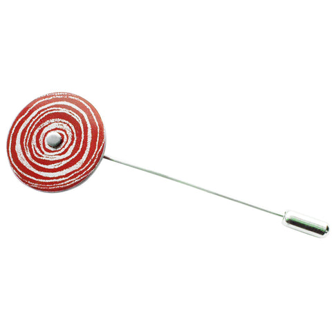 Pin with disk in red and silvery patterned concentric circles with a small silver disk at the centre.