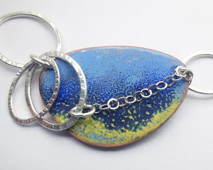 Enamelled pendant with silver jumprings