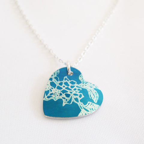 Hand made aluminum blue carnations birth flower heart pendant ith siver chain by Sally Lees
