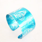 Aluminium Sky Blue Butterflies motif cuff hand made by design maker Sally Lees