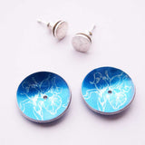 Handmade blue aluminium iris motif earrings with siver stud centres