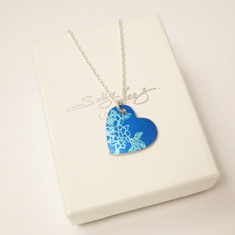 Hand made aluminum blue carnations birth flower heart pendant ith siver chain by Sally Lees