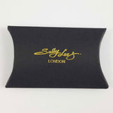 Black pillow shaped gift box with gold embossed Sally Lees London logo in the centre of the gift box.