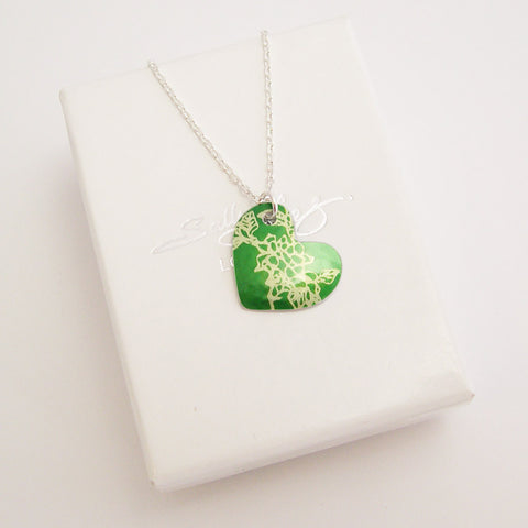 hand made aluminum green carnations birth flower hear pendant with silver chain by Sally Lees