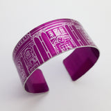 Bright magenta cuff with an architectural drawing of part of a grand building including windows and the top of a door way