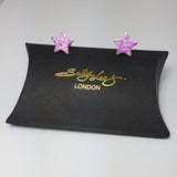 Aluminium pink star studs with abstract roses pattern in a silvery colour.