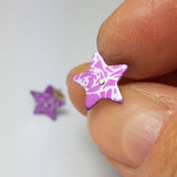 Pink star studs with abstract roses pattern in a silvery colour.