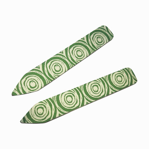 Women's suffrage collar stiffeners in green with silvery patterns of scrolls down the length of each collar stiffener.