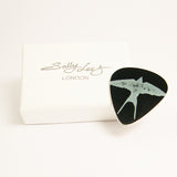 Hand-made aluminum black swallow guitar pick by Sally Lees