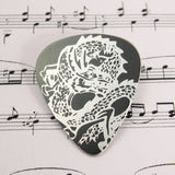 Black Chinese Dragon hand made contemporary aluminum guitar pick by Sally Lees