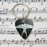 hand made aluminum Black swallows guitar pick keyring by Sally Lees