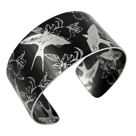 black aluminium hand made cuff with swallows and iris prints 